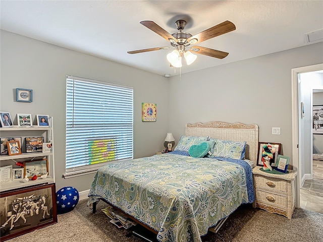 bedroom with ceiling fan, carpet floors, visible vents, and baseboards