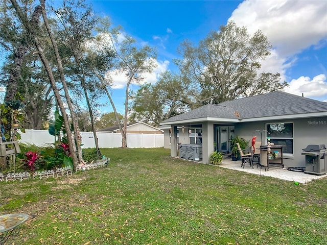 view of yard featuring a patio area and a fenced backyard