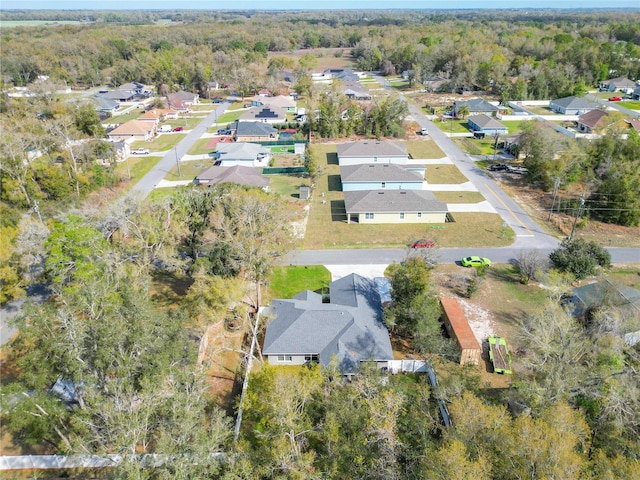 bird's eye view with a forest view and a residential view