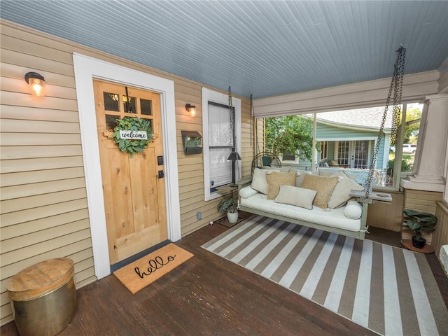 entrance to property featuring a porch