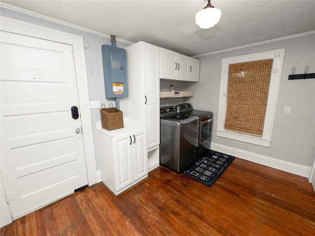 clothes washing area with dark wood-style floors, cabinet space, ornamental molding, electric panel, and independent washer and dryer