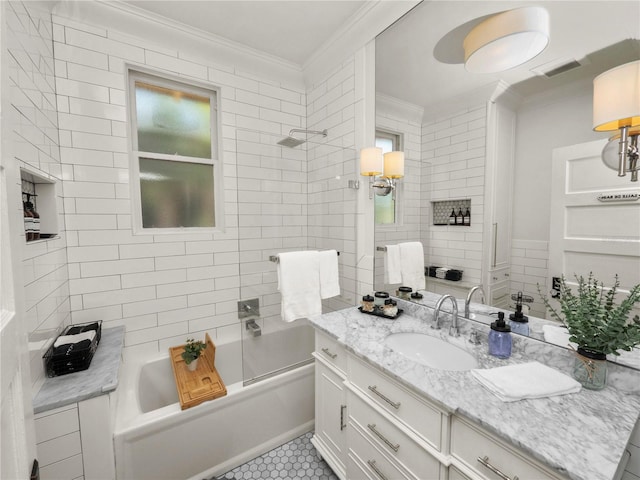 bathroom with visible vents, crown molding, vanity, and bathing tub / shower combination