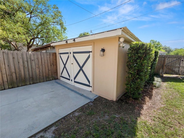 view of shed with a fenced backyard