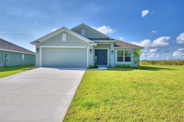 ranch-style house featuring a garage, driveway, a front yard, and stucco siding