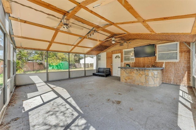 unfurnished sunroom with vaulted ceiling