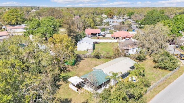 birds eye view of property featuring a wooded view