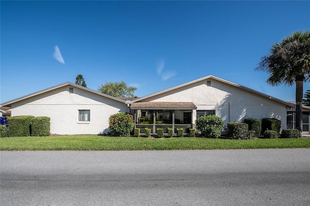 view of property exterior featuring a yard and stucco siding