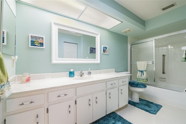 full bathroom featuring toilet, enclosed tub / shower combo, visible vents, and vanity