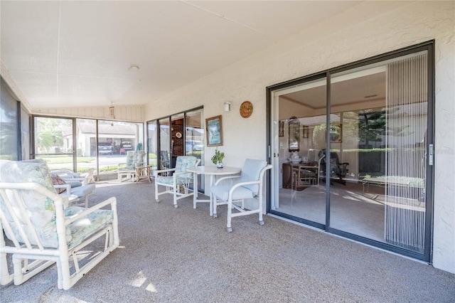 unfurnished sunroom featuring vaulted ceiling