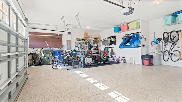 garage with electric panel, water heater, and a garage door opener