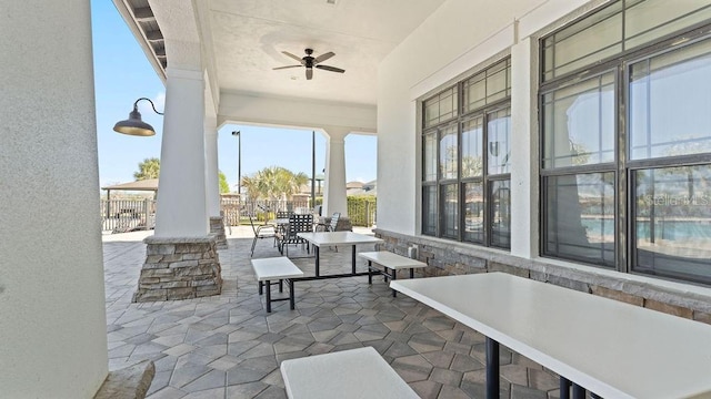 view of patio / terrace with outdoor dining area and ceiling fan