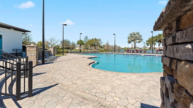 pool with a patio area