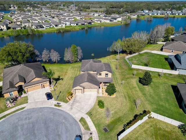 birds eye view of property with a water view and a residential view