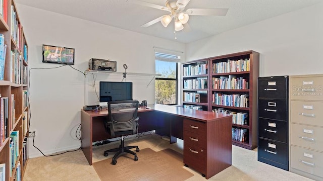 office featuring light carpet and ceiling fan