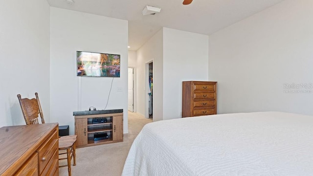 bedroom with ceiling fan and light colored carpet