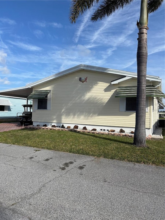 view of property exterior with a carport