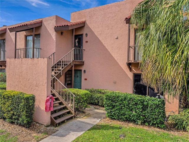 view of property featuring stairway