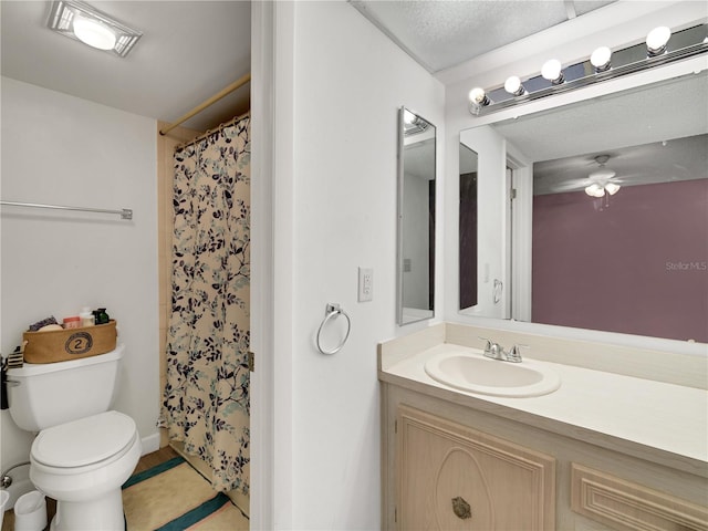 bathroom featuring a shower with curtain, toilet, and vanity