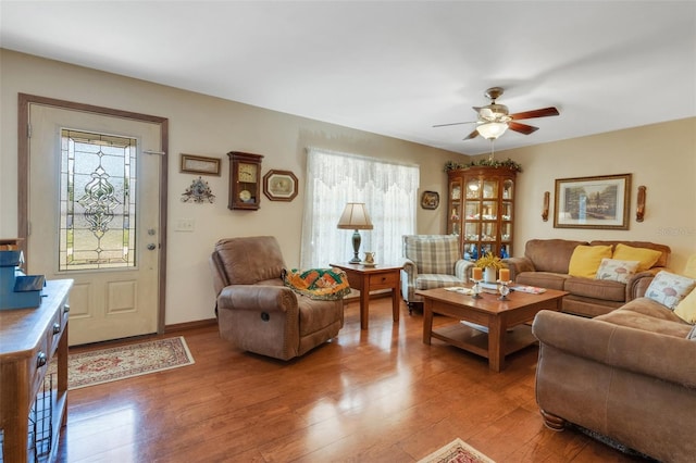 4643 1st St NW, Lakeland, FL 33810 - living area featuring light wood-style floors, a healthy amount of sunlight, and a ceiling fan