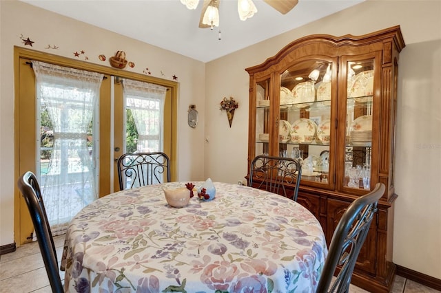 4643 1st St NW, Lakeland, FL 33810 - dining area featuring light tile patterned flooring, a ceiling fan, and baseboards
