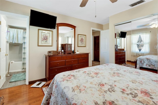4643 1st St NW, Lakeland, FL 33810 - bedroom with light wood-style flooring, baseboards, visible vents, a ceiling fan, and a closet