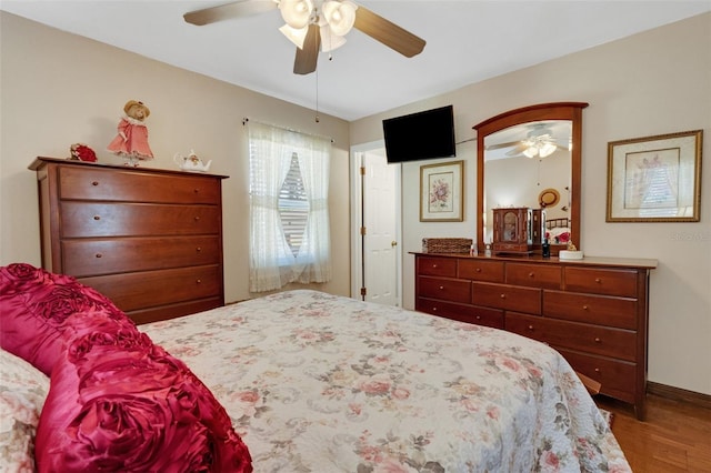 4643 1st St NW, Lakeland, FL 33810 - bedroom featuring wood finished floors, a ceiling fan, and baseboards