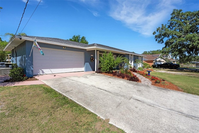 4643 1st St NW, Lakeland, FL 33810 - single story home with an attached garage, concrete driveway, a front lawn, and stucco siding