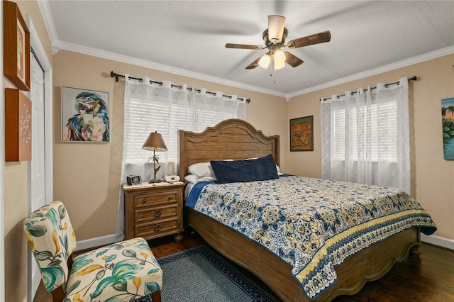 bedroom featuring dark wood-style floors, crown molding, a ceiling fan, a textured ceiling, and baseboards