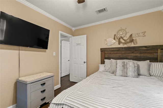 bedroom featuring visible vents, baseboards, dark wood-style floors, ceiling fan, and crown molding