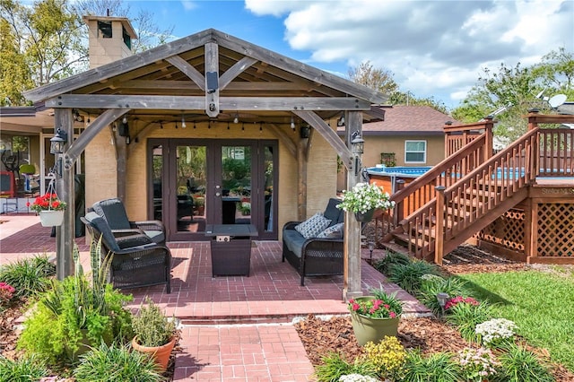 back of property featuring stairs, french doors, a chimney, and a patio area