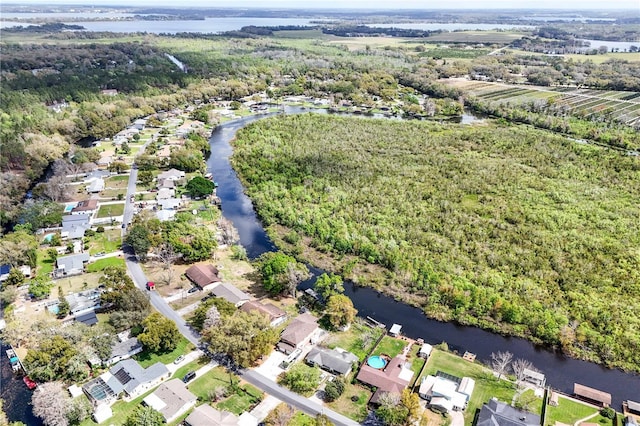 drone / aerial view featuring a residential view and a water view