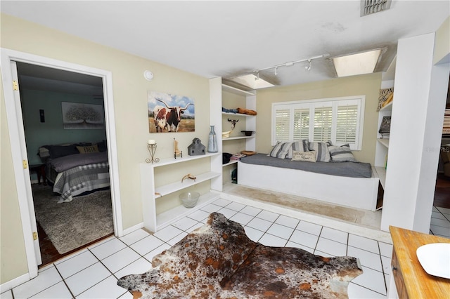 bathroom featuring connected bathroom, rail lighting, visible vents, and tile patterned floors