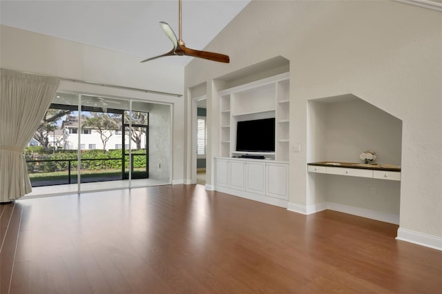 unfurnished living room featuring a ceiling fan, baseboards, built in features, and wood finished floors