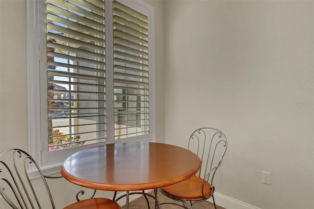 dining space with baseboards