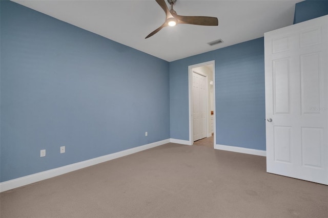 unfurnished bedroom with ceiling fan, carpet, visible vents, and baseboards