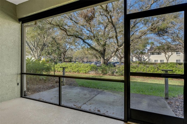 unfurnished sunroom featuring plenty of natural light