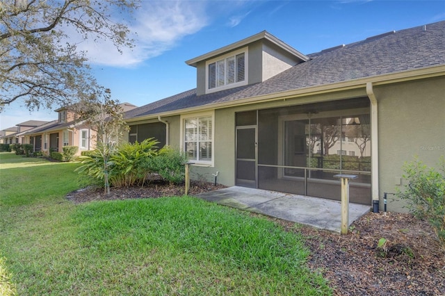 exterior space featuring stucco siding, roof with shingles, and a yard