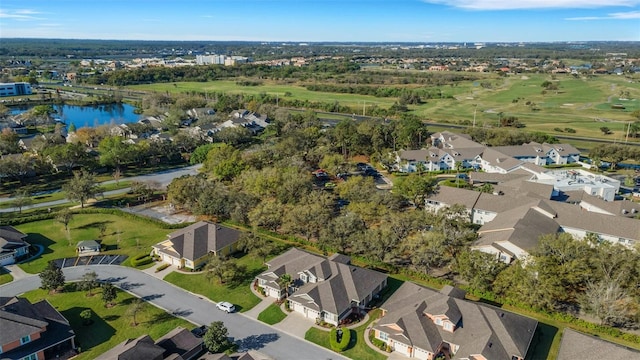 drone / aerial view featuring a residential view and a water view