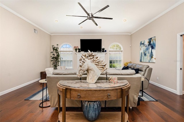 living area with crown molding, wood finished floors, visible vents, and baseboards