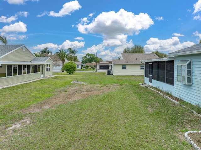 view of yard featuring a sunroom