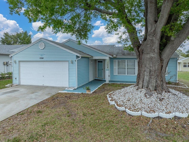 single story home featuring driveway, a shingled roof, and an attached garage