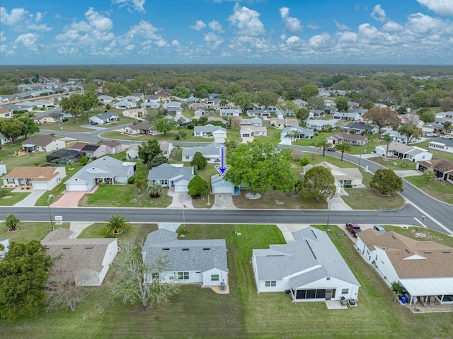 birds eye view of property with a residential view