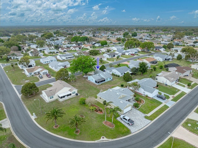 birds eye view of property with a residential view