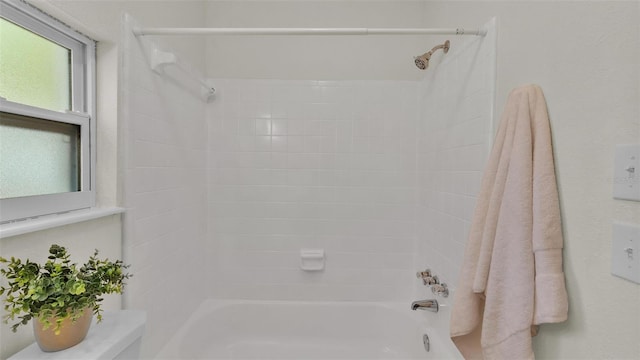 bathroom with shower / washtub combination