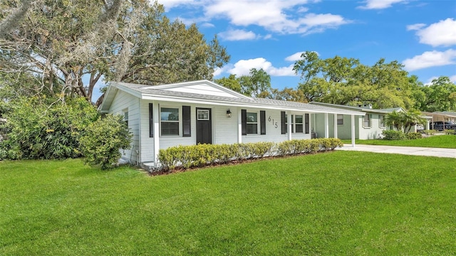 ranch-style house with concrete driveway and a front yard