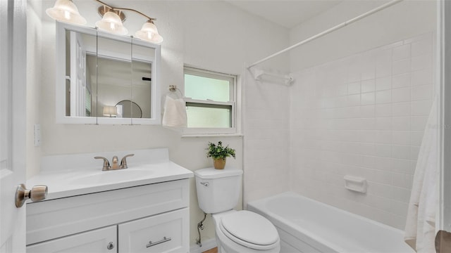 bathroom with shower / tub combo, vanity, and toilet