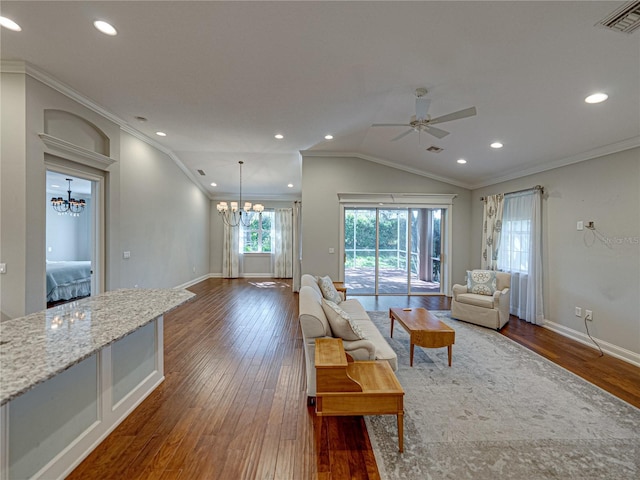 living area with baseboards, visible vents, lofted ceiling, dark wood-style flooring, and ornamental molding