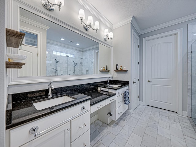 bathroom featuring vanity, a shower stall, crown molding, and marble finish floor