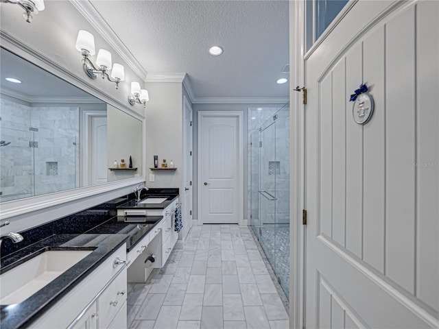 full bath featuring double vanity, a stall shower, crown molding, and a sink