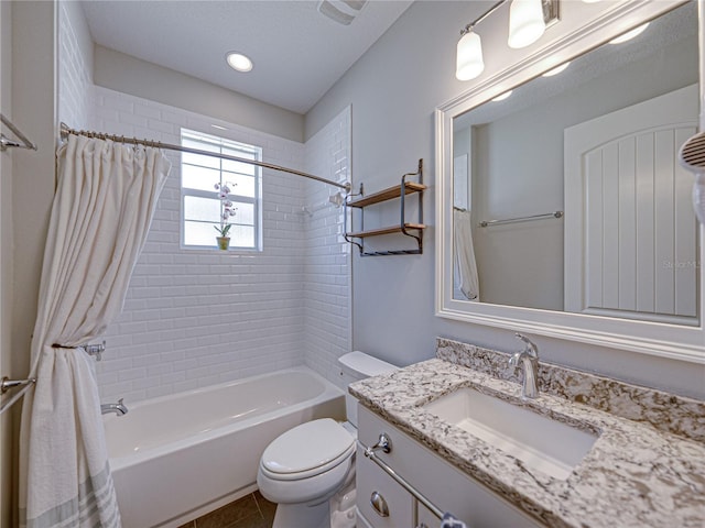 bathroom featuring tile patterned floors, toilet, vanity, and shower / bath combo